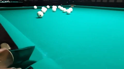 Close-up billiard table, pockets and green cloth on which billiard balls roll Video stock 109546763