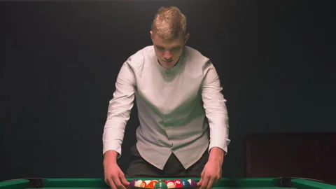 Close-Up of Billiards Trainee Focused on Pool Table Preparing to Break Stock Footage 302990305