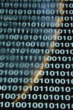Close up of binary code over optic fibers Stock Photos