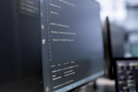 Close up of binary script running on PC monitors 写真素材