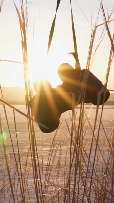 Close-up of binoculars spinning at sunset. The harmony of man and nature. Stock Footage 267646729