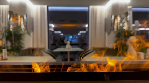 Close-up on bio fireplace burning inside restoran. Detail in interior Stock Footage 285344945