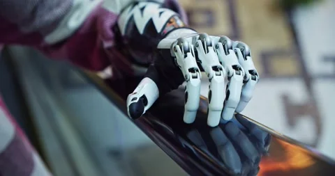 Close-up of a bionic hand holding on to the handrail on the escalator. a female Stock Footage 159910034