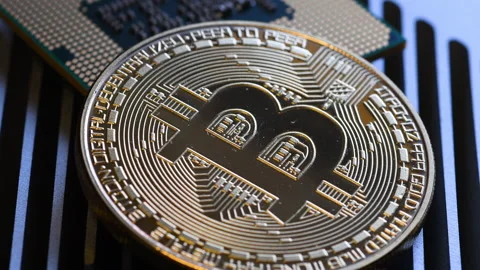 Close Up of Bitcoin and CPU Processor on aluminum heat sink. Stock Footage 160324943
