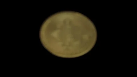 Close-up of a Bitcoin on a black background 库存影片 328286246