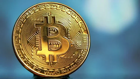 Close-up of a Bitcoin on a blurred background Vídeos de archivo 328286247