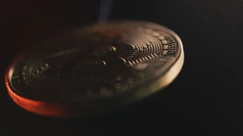 Close-up of a Bitcoin Coin with Dramatic Lighting Stock Footage 328289478