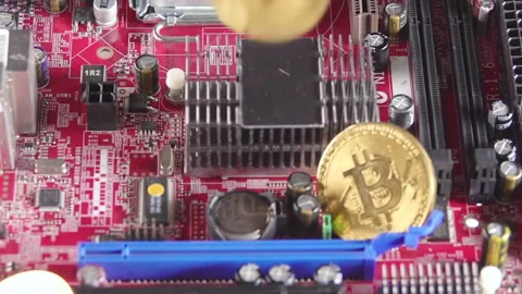 Close-up of Bitcoin Coins on Computer Motherboard Stock Footage 328286434