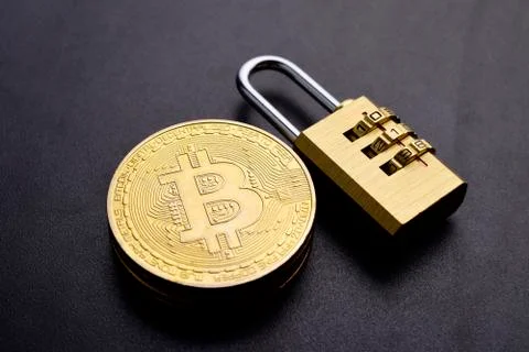 Close up of bitcoin with lock, cryptocurrency security concept. Stock Photos