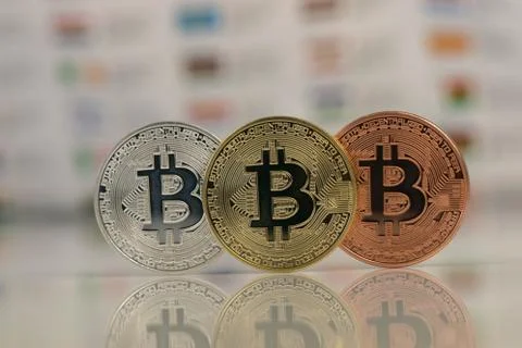 Close up of Bitcoins, gold bitcoin, silver bitcoin and bronze bitcoin with Stock Photos
