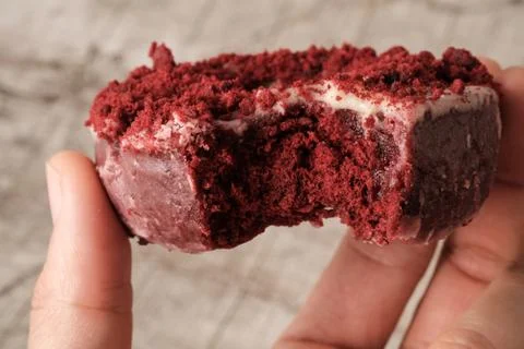 Close up bite missing red velvet donut Stock Photos