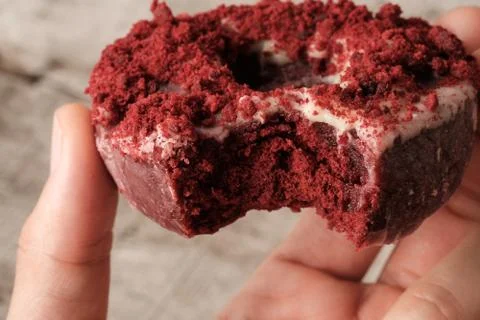 Close up bite missing red velvet donut Stock Photos