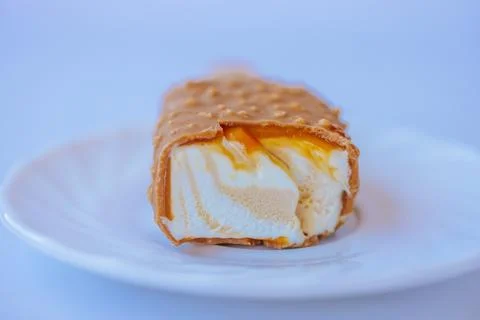 A close-up of a bite-sized caramel ice cream bar with. Stock Photos