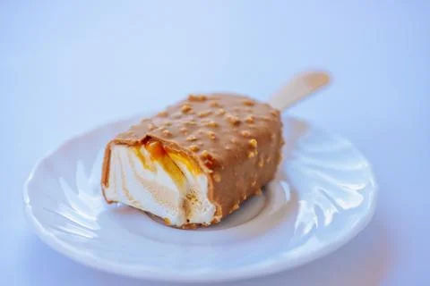 A close-up of a bite-sized caramel ice cream bar with. Stock Photos