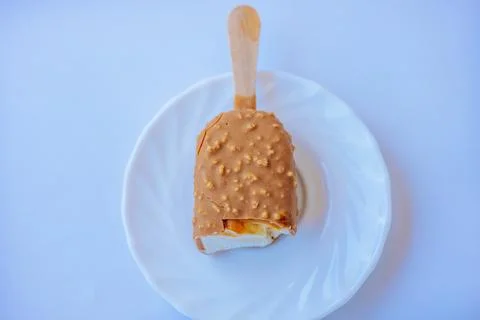 A close-up of a bite-sized caramel ice cream bar with. Stock Photos
