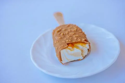 A close-up of a bite-sized caramel ice cream bar with. Stock Photos