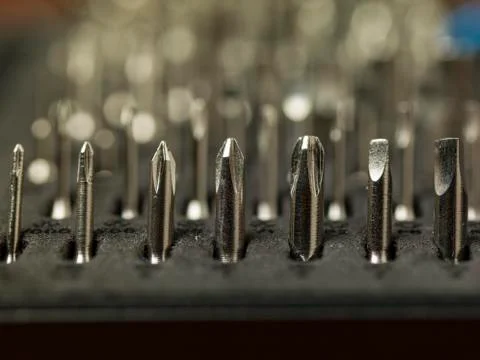 Close-up on bits, metal tips for various screws Stock Photos