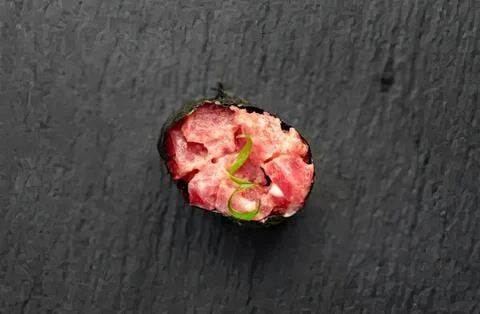 Close-up of a bitten strawberry on dark background Stock Photos