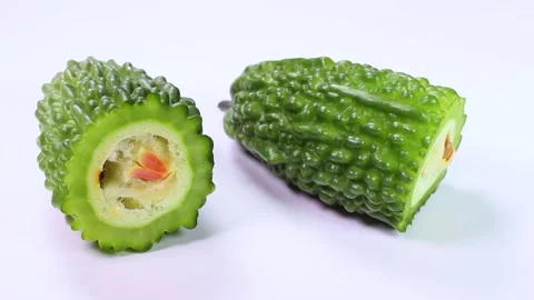 Close up of bitter melon cross section, rotating Stock Footage 313815565