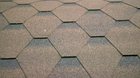 Close-up. Bituminous roof texture. Rough bituminous mosaic of brown and black Stock-Footage 113570643