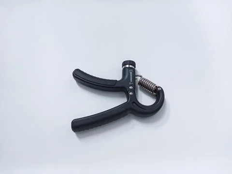 Close up Black Adjustable Hand Grip Strengthener Isolated On White Backgrou.. Stock Photos