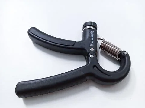 Close up Black Adjustable Hand Grip Strengthener Isolated On White Backgrou.. Stock Photos