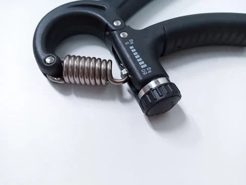 Close up Black Adjustable Hand Grip Strengthener Isolated On White Backgrou.. Stock Photos