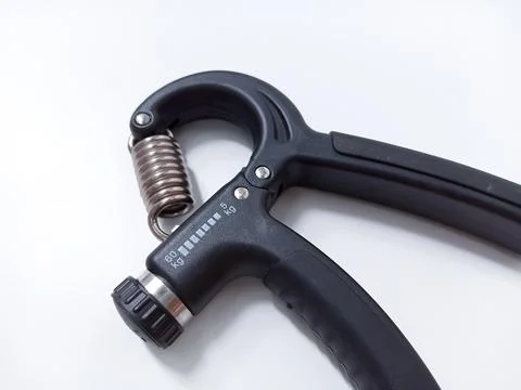 Close up Black Adjustable Hand Grip Strengthener Isolated On White Backgrou.. Stock Photos