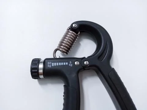 Close up Black Adjustable Hand Grip Strengthener Isolated On White Backgrou.. Stock Photos