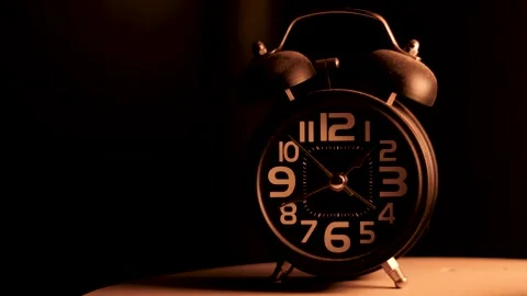 Close-up of a black alarm clock at 01:00 AM, early morning "INSOMNIA" 動画素材 253763137