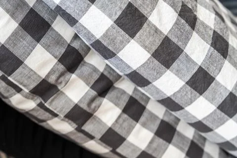 Close-up of black and white checkered fabric pattern, showcasing textile texture Stock Photos