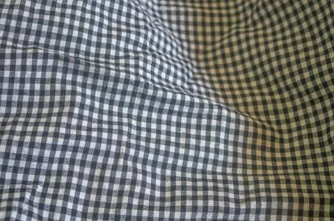Close up on a black and white gingham fabric with a classic checkered patte.. Stock-Fotos
