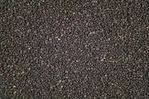 Close-up of black asphalt road surface with rough texture Stock Photos