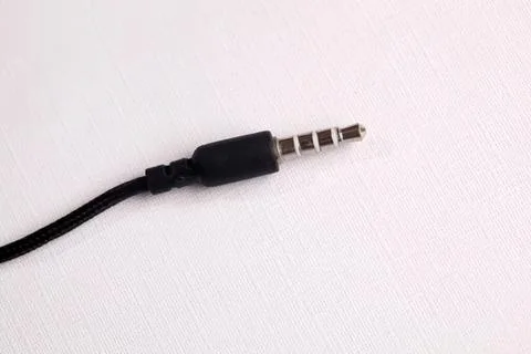 Close-up of black audio jack connector on white background Stock Photos