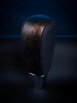 Close-up of a black automatic transmission knob made of leather with a wooden Stock Photos