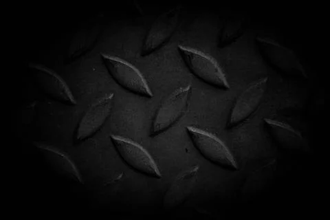 Close-up black background image with many beautiful buttons on a common metal Stock Photos