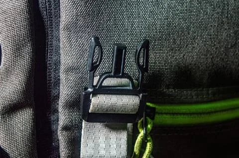 Close up of a black backpack buckle and strap on rugged fabric, highlightin.. Foto stock