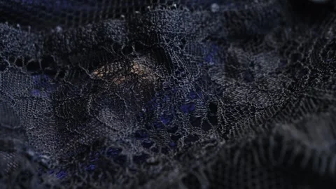 Close-up of black beautiful lace texture fabric. Close up of an elegant black Stock Footage 315230126