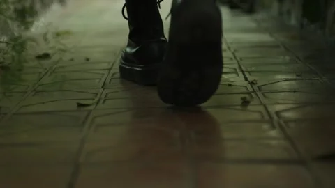 Close-up of black boots walking in slow motion. Stock Footage 295929243