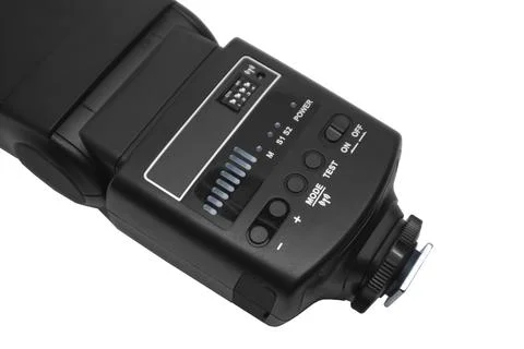 Close-up of a black camera flash speedlight back control panel with buttons.. Stock Photos