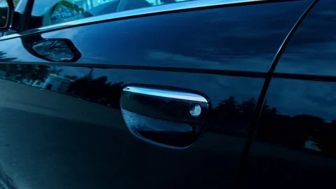 Close-up of black car door handle. Car details presentation in slowmotion Stock Footage 143798556