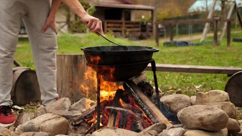 Close-up of a black cauldron on a bonfire. Stock Footage 295843803