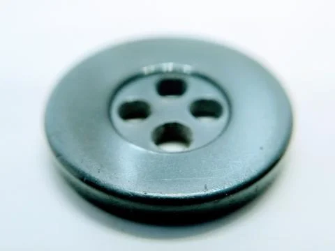 Close up on black cloth button on white background Stock Photos