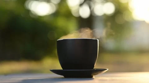 Close-up of a black coffee mug placed on a rustic table Stock Footage 294795073