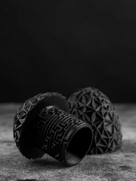 Close up of black complex maze for storing gift on black background Stock Photos