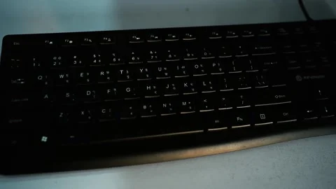 Close-Up of Black Computer Keyboard on White Surface, A close-up view of a .. Stock Footage 304961693