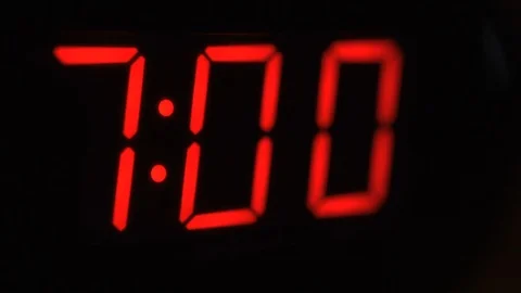 Close-up of black digital clock screen showing 7.00. Modern timer system Stock Footage 121256948