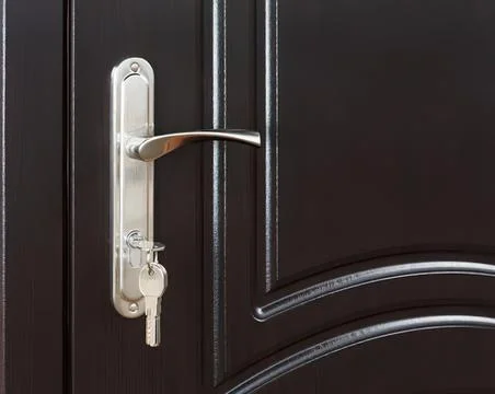 Close-up of black door with silver handle and lock Photos