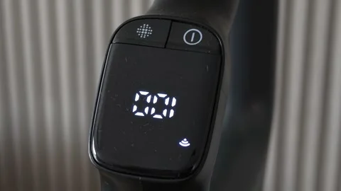 Close Up Of Black Electronic Remote Control With Digital Display Vidéo 343370463