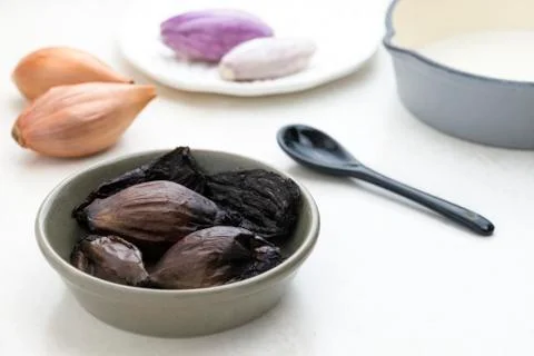 Close up of black fermented onions Stock Photos